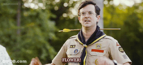 Scout With Arrow Through Neck Saying Flower GIF