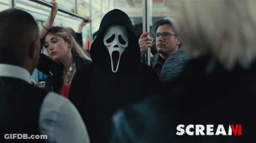 Scream Poster With Ghost Face Mask GIF