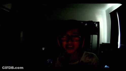 Screaming Boy In Dark Room With Glasses And Headphones GIF