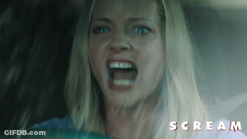 Screaming Woman In Car With Scream Text GIF