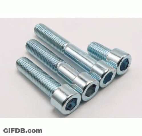 Screws Stacked On White Surface GIF