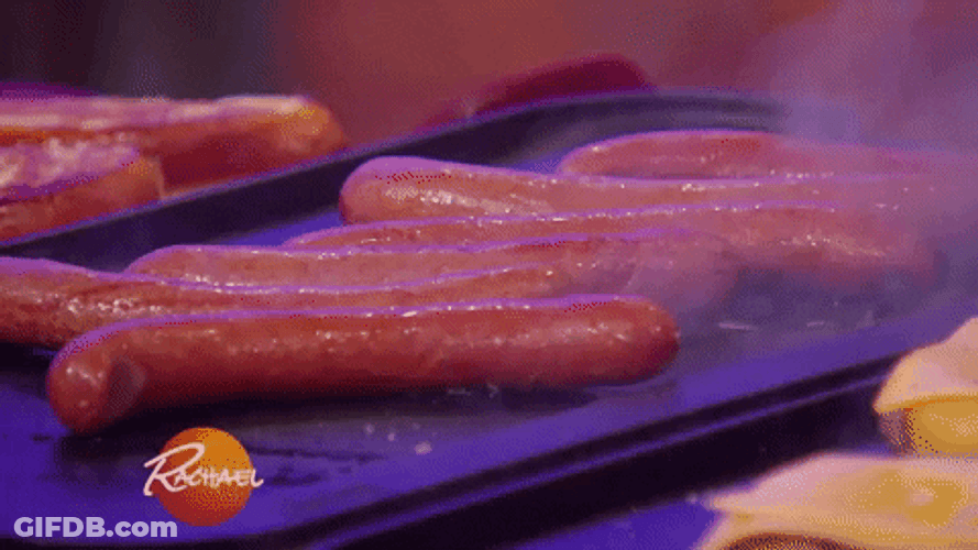 Scrumptious Sausages Smoking In Grill GIF