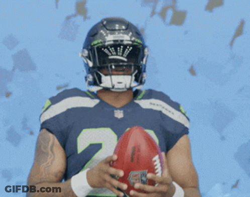 Seahawks Football Player Holding Football GIF