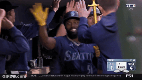 Seattle Baseball Players High Five In Dugout GIF