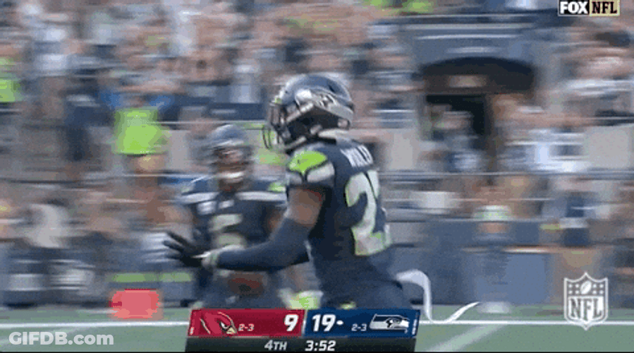 Seattle Seahawks Riq Woolen Running Freely GIF