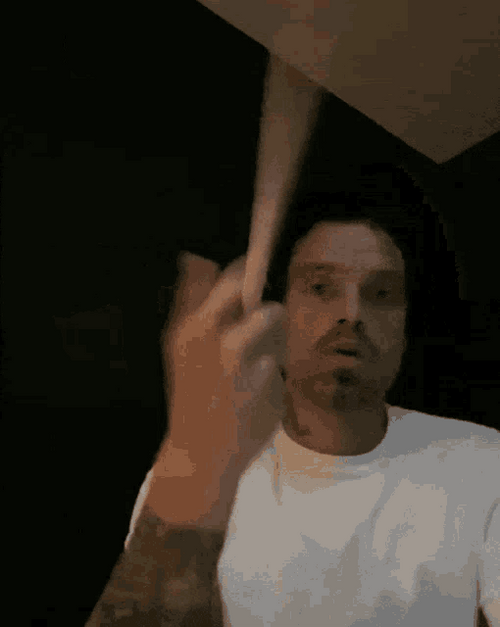 Sebastian Stan Twirling Drumstick GIF