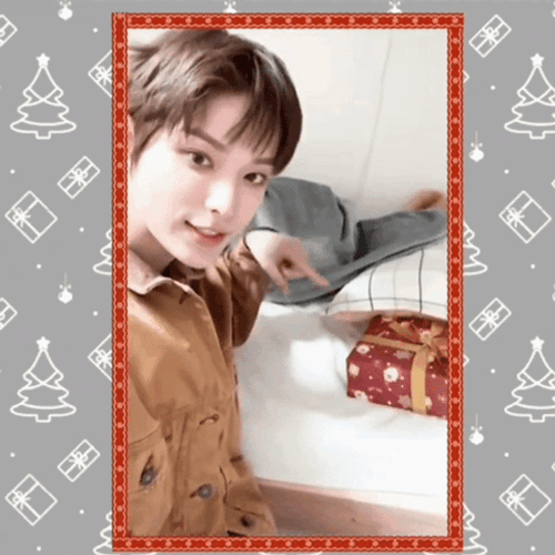 Secret Santa Pointing Gift GIF