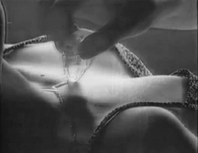 Sensual Putting Oil On Woman Chest GIF