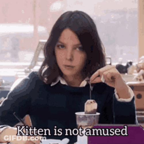 Serious Girl Dipping Tea Bag In Cup GIF