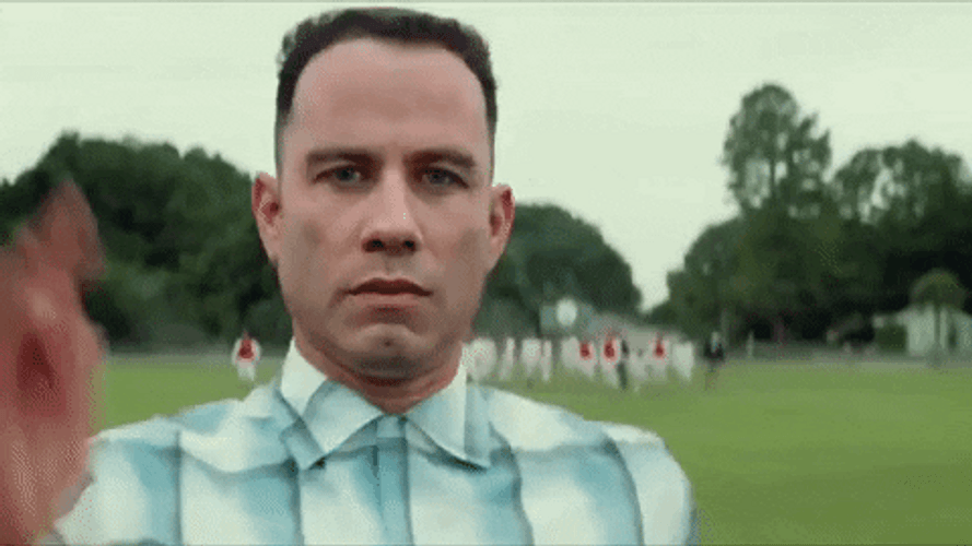 Serious John Travolta Running GIF