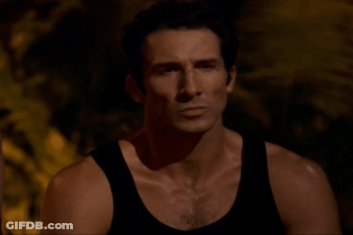 Serious Man In Black Tank Top GIF