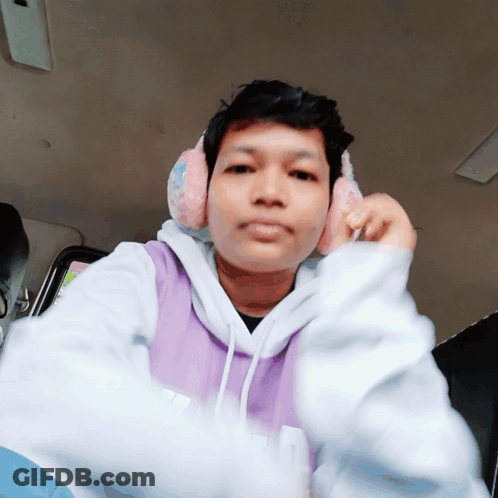 Serious Man In Purple Hoodie With Headphones GIF