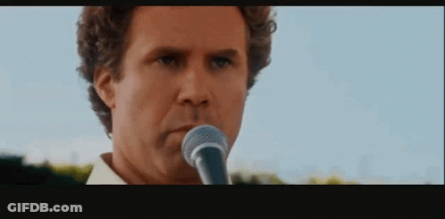 Serious Man Singing Into Microphone GIF