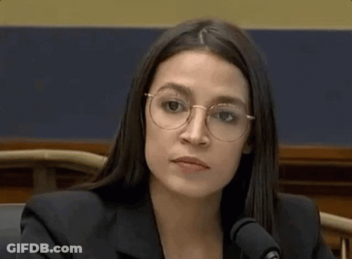 Serious Woman In Glasses At Microphone GIF