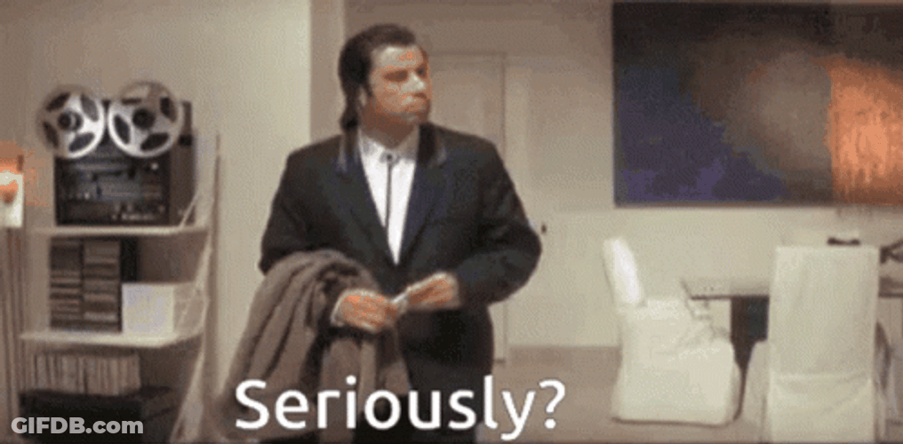 Seriously Confused John Travolta Looking Around Meme GIF