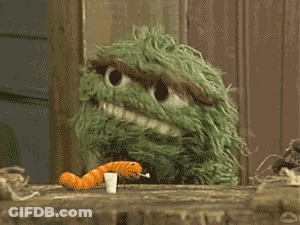 Sesame Street Character Eating Carrot And Pill GIF