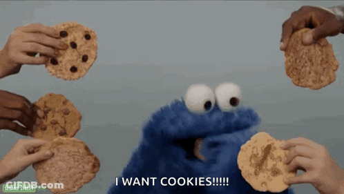 Sesame Street Cookie Monster Surrounded By People Holding Cookies GIF