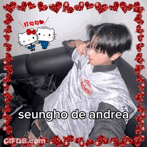Seungho De Andrea Is Sitting On A Couch With Hello Kitty GIF