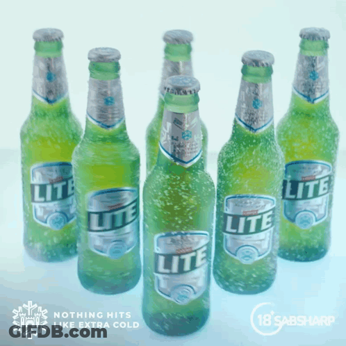 Several Bottles Of Lite Beer Are Lined Up On Ice GIF