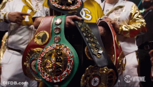 Several Boxing Belts Are Displayed Including One That Says Wbc On It GIF