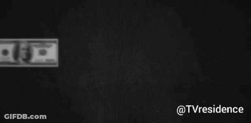 Several Hundred Dollar Bills Are Lined Up On A Black Background GIF