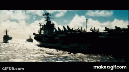 Several Military Ships Floating In Ocean GIF