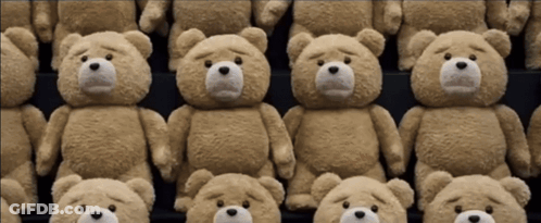 Several Teddy Bears Are Lined Up In A Row With Sad Faces GIF