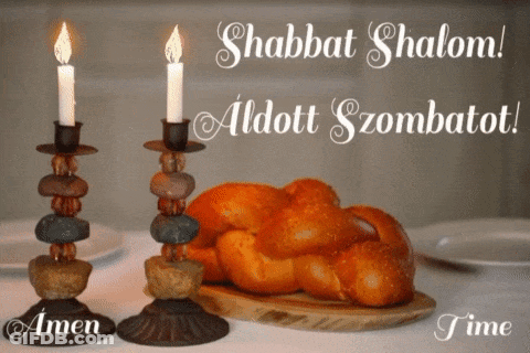 Shabbat Shalom Written On A Card With Two Candles And A Loaf Of Bread GIF