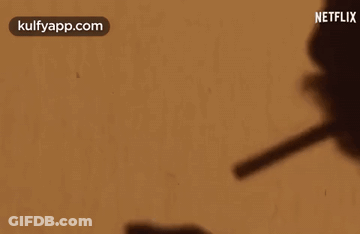 Shadow Person Holding Pen Netflix Logo GIF