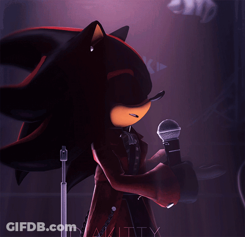 Shadow The Hedgehog Is Holding A Microphone And Pointing At It GIF