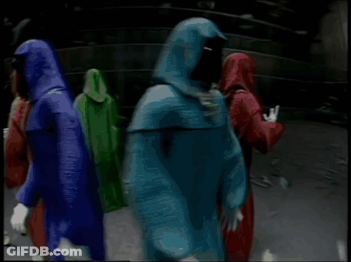 Shadow Wizard And Money Gang Are Holding Signs In A Dark Room GIF