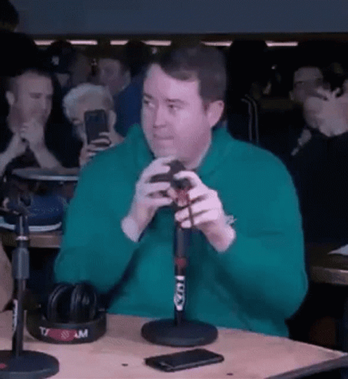 Shane Gillis Fixing Mic Side Eye GIF