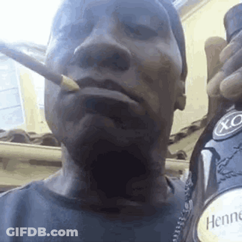 Shannon Sharpe Holding Wine Bottle GIF