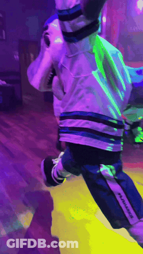 Shark Mascot Jumping With Purple Background GIF