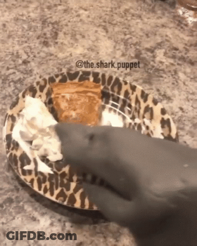 Shark Reaching For Pie On Leopard Print Plate GIF