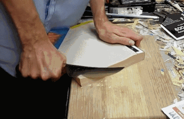 Sharp Knife Cutting Thick Book GIF