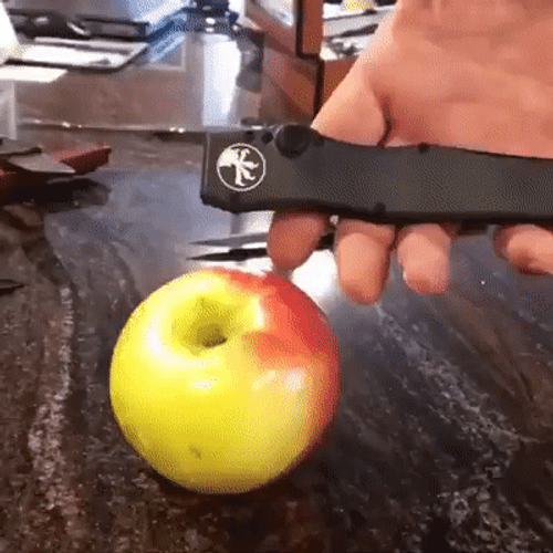 Sharp Knife Pointing Apple GIF