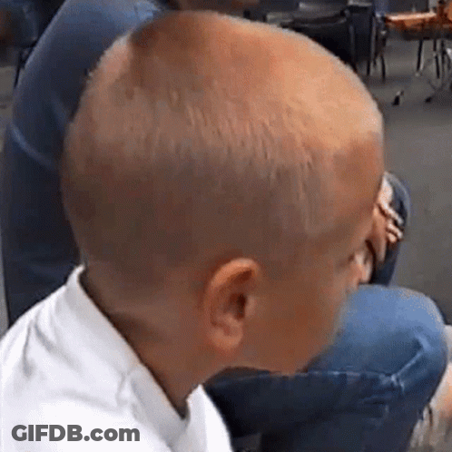 Shaved Head Boy Next To Woman In Chair GIF