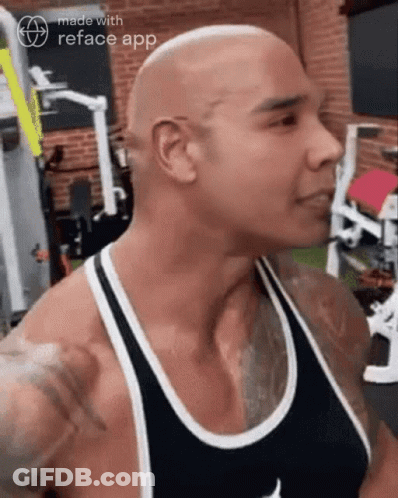 Shaved Head Man In Black Tank Top GIF