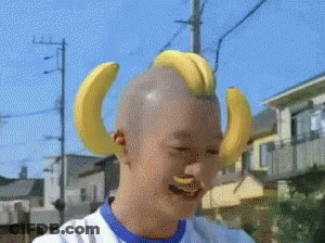 Shaved Head With Bananas On Ears GIF