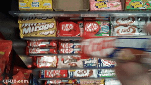 Shelf Full Of Candy Including Kitkats And Mirage GIF