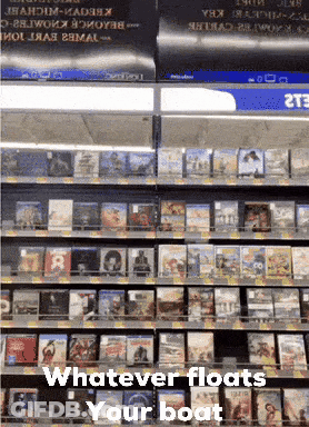 Shelf Of DVDs Saying Whatever Floats Your Boat GIF