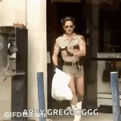 Sheriff Carrying Bag Of Trash GIF