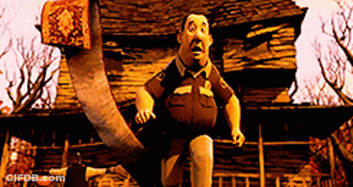 Sheriff Running Past Wooden Building GIF