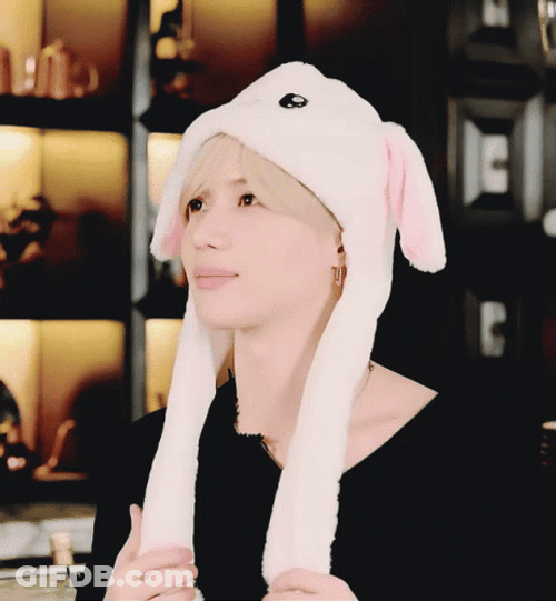 SHINee Taemin Playing With Rabbit Hat Ears GIF