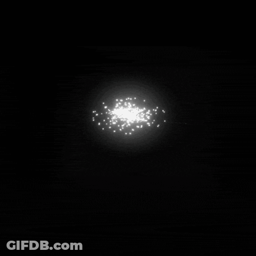 Shining Particles Forming Vortex GIF