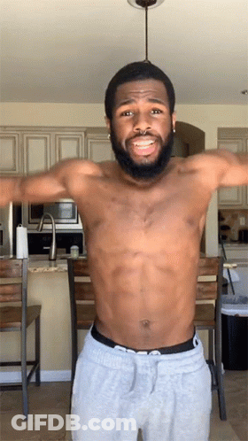 Shirtless Bearded Man Arms Outstretched In Kitchen GIF
