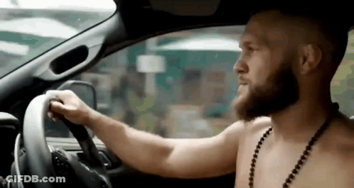 Shirtless Bearded Man Driving Car GIF