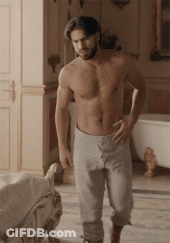 Shirtless Bearded Man Hands On Hips In Bathroom GIF