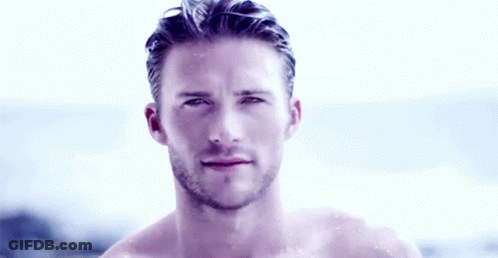 Shirtless Bearded Man Standing By Ocean GIF